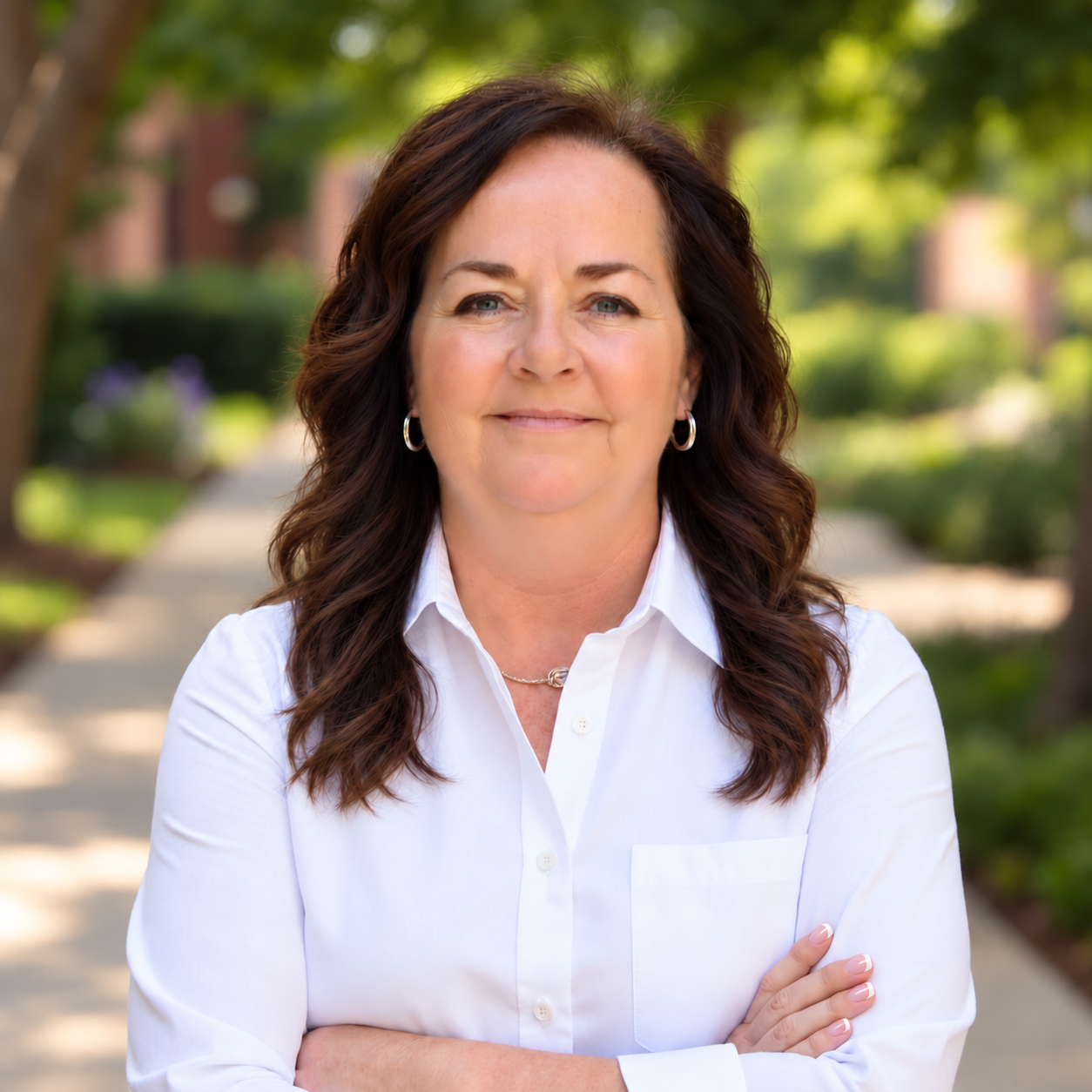 Kate Brown wearing a white shirt outdoors